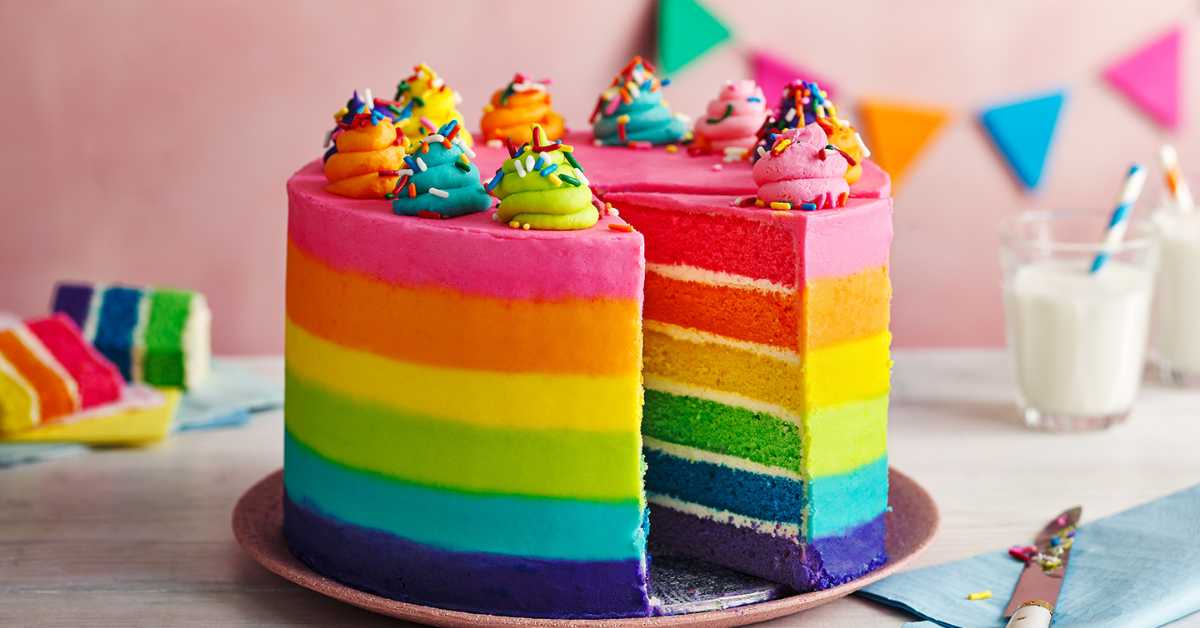A colorful rainbow cake. Food dyes are used to color the frosting and cake batter.