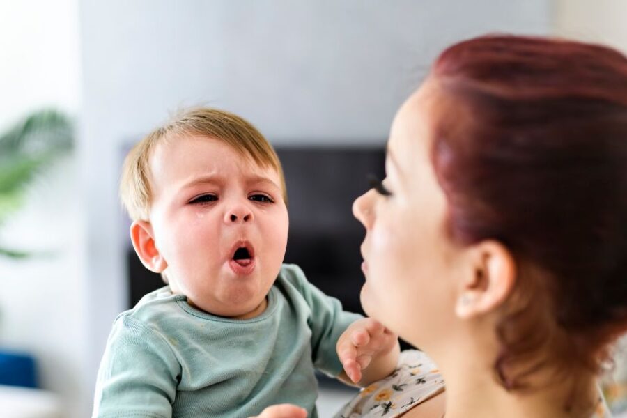 A sick baby coughs.