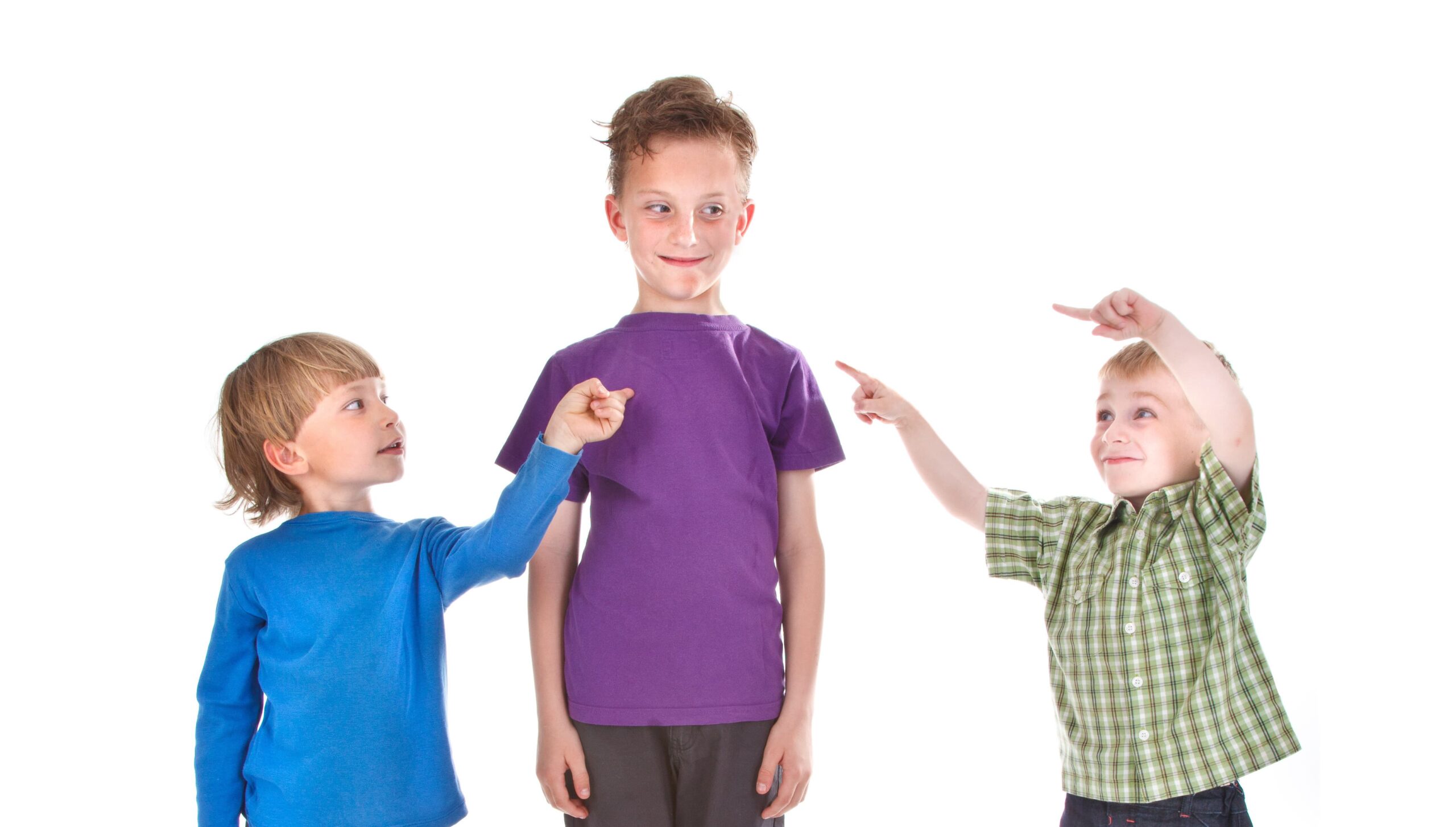 A group of children pointing fingers at one another.