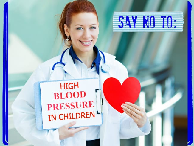 A doctor holds a sign that says, "Say no to high blood pressure in children."