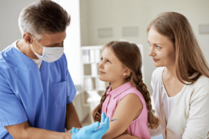girl getting vaccinated with doctor she can trust