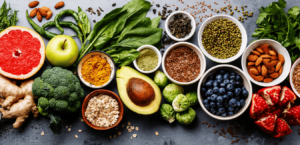 A variety of healthy foods full of essential nutrients arranged beautifully on a wooden table.