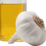 DIY Ear Oil recipe ingredients include olive oil and fresh garlic. 