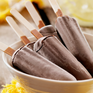 A bowl of homemade chocolate popsicles.
