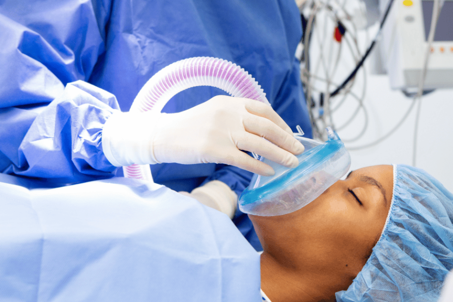 A girl in a hospital receives anesthesia.