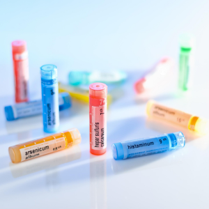 Several colorful bottles of homeopathic remedies.