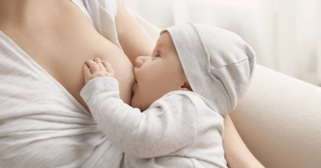 A mother breastfeeds her baby.