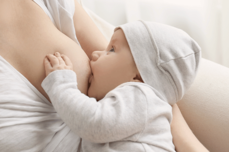 A mother breastfeeds her baby.