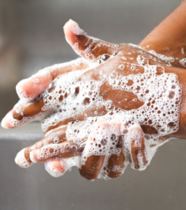 Hands covered in soap.