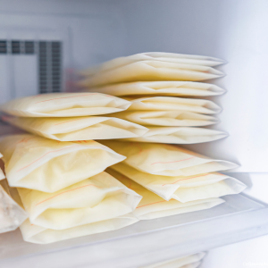 Bags of frozen breast milk in a freezer. 