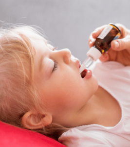 Homeopathic medicine is given to a girl.