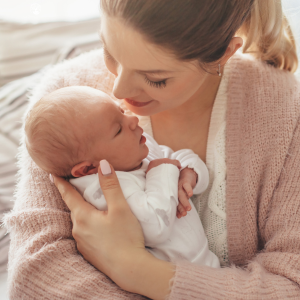 A mother holds her newborn baby. 