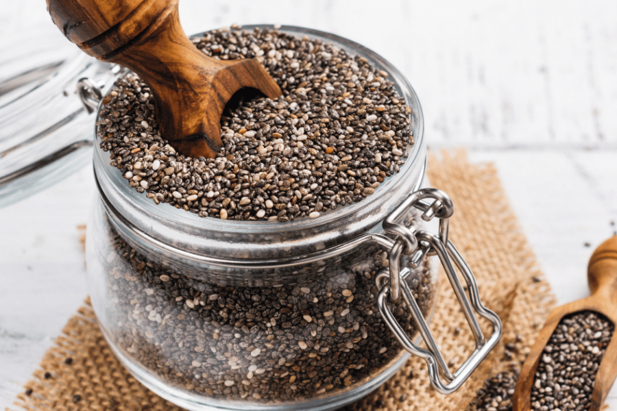 A glass jar of chia seeds.