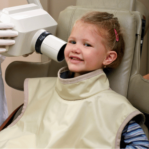 A child gets dental x-rays.