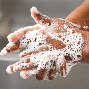 Two soapy hands pressed together.