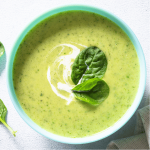 A bowl of green soup.