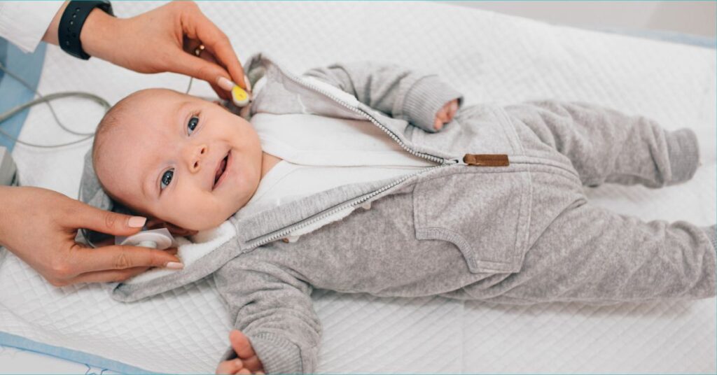 A baby undergoes a hearing test.