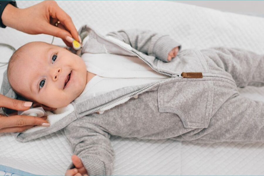 A baby undergoes a hearing test.