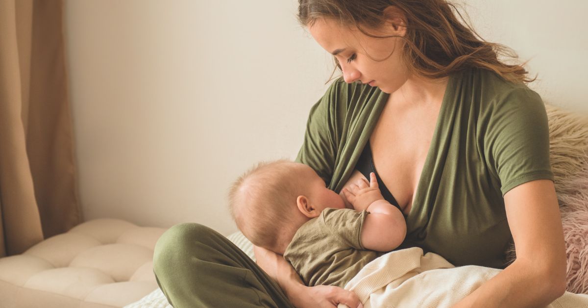 A mom breastfeeds her infant.