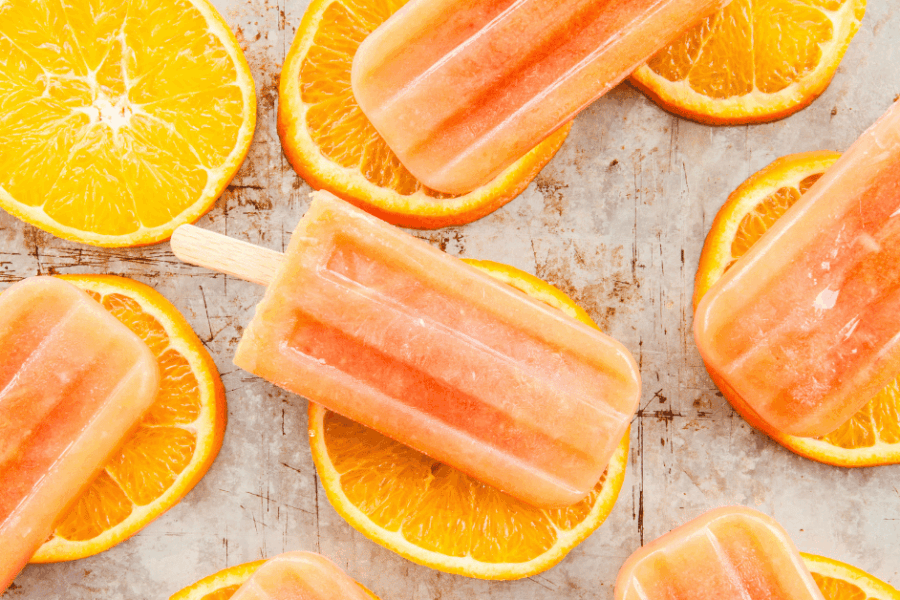 Homemade orange popsicles.